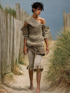 Ashore_coastal_style_richly_textured_off-the-shoulder_knit_top_paired_with_relaxed_voluminous_striped_shorts-1