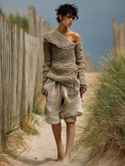 Ashore_coastal_style_richly_textured_off-the-shoulder_knit_top_paired_with_relaxed_voluminous_striped_shorts